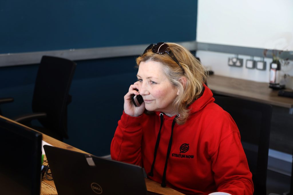 A person taking an IT support telephone call in Cumbria
